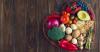 Heart shaped platter of fresh fruits, vegetables, grains, and legumes