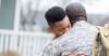 family member hugging military service member